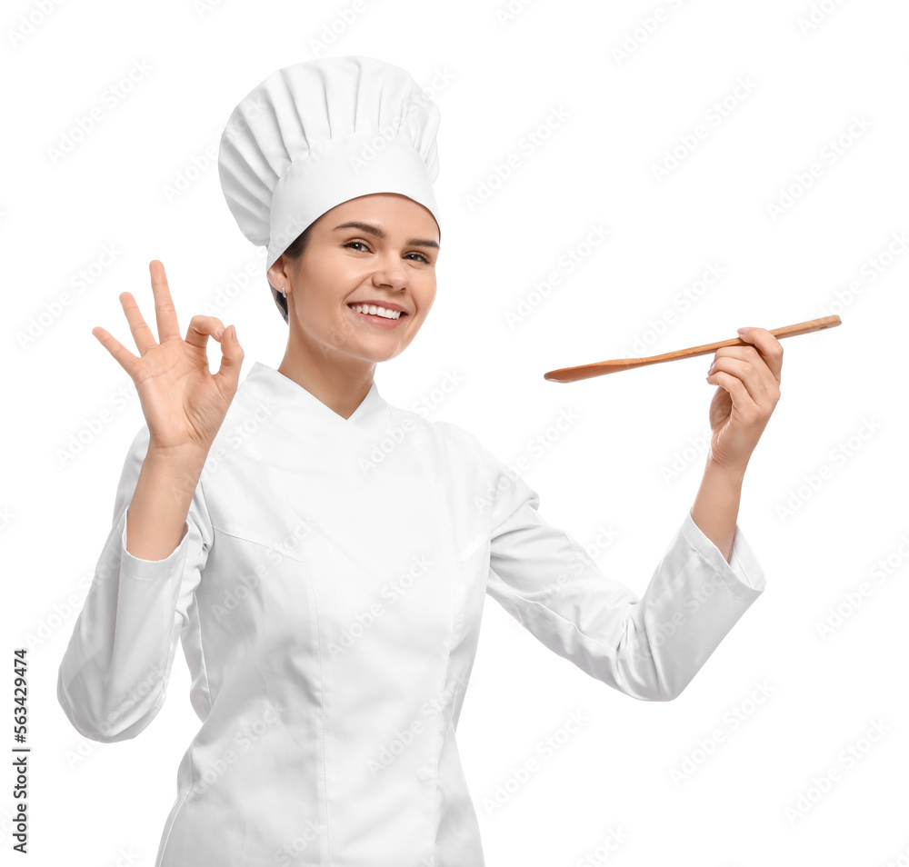 Happy female chef with wooden spoon showing ok gesture on white background Happy female chef with wooden spoon showing ok gesture on white background