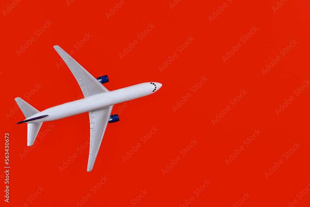 Airplane model white plane on red background Airplane model white plane on red background