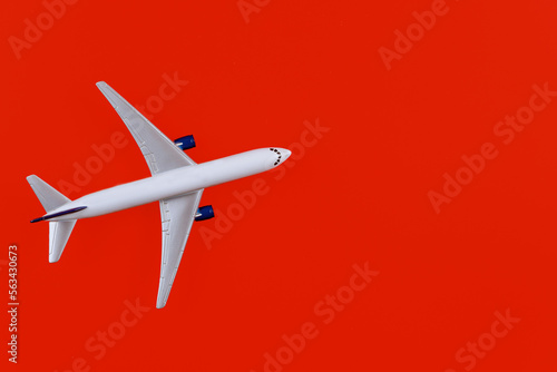 Airplane model white plane on red background