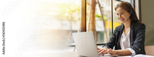 call center and headset with copy space panorama banner . customer online service . operator.  business woman video conference calling on laptop computer online service. meeting online work form home