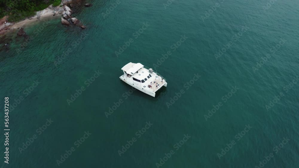 4K Aerial view Group of Asian people enjoy and fun celebration party drinking champagne and dancing together while travel on luxury private catamaran boat yacht sailing in the ocean on summer vacation 4K Aerial view Group of Asian people enjoy and fun celebration party drinking champagne and dancing together while travel on luxury private catamaran boat yacht sailing in the ocean on summer vacation