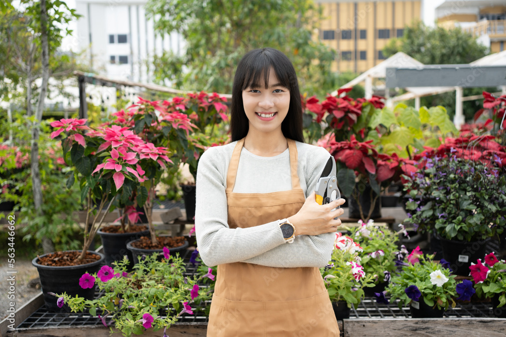 Smiling Asian woman standing confident  entrepreneur business owner flower plant. garden plant care for sale, beauty and nature.