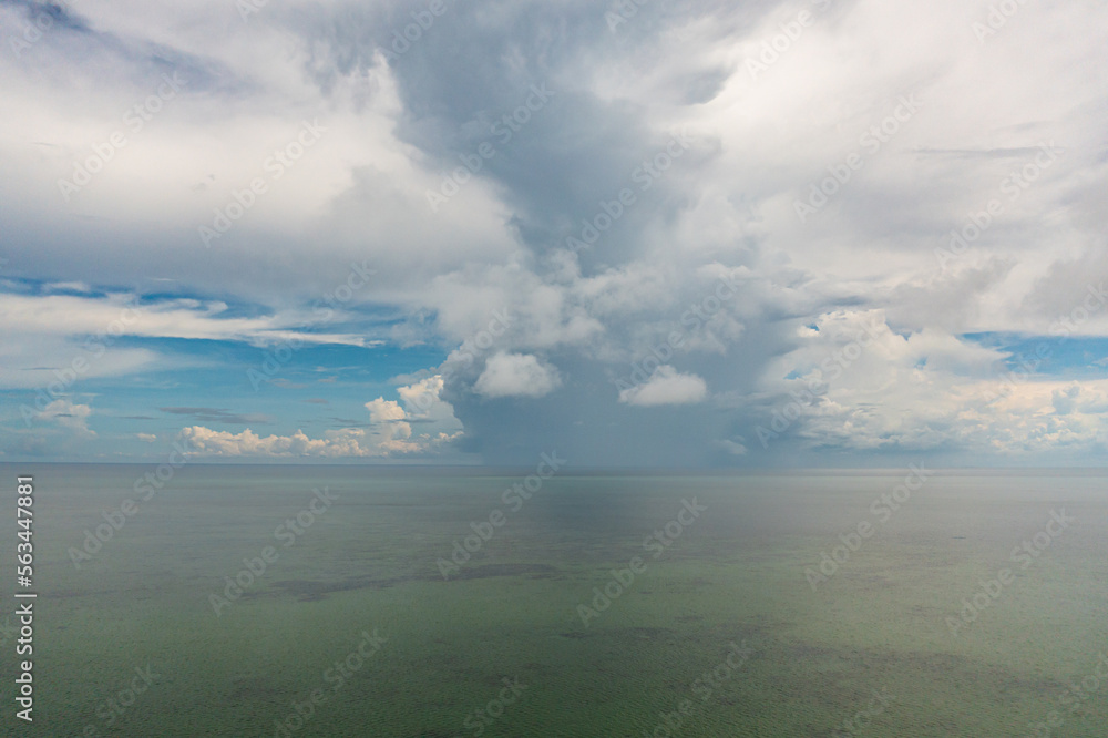 Obraz premium Beautiful stunning vibrant landscape, blue sea and sky with white clouds, aerial view of the sea