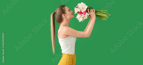 Young woman with bouquet of...