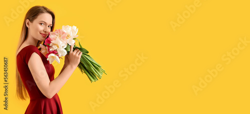 Young woman with bouquet of...