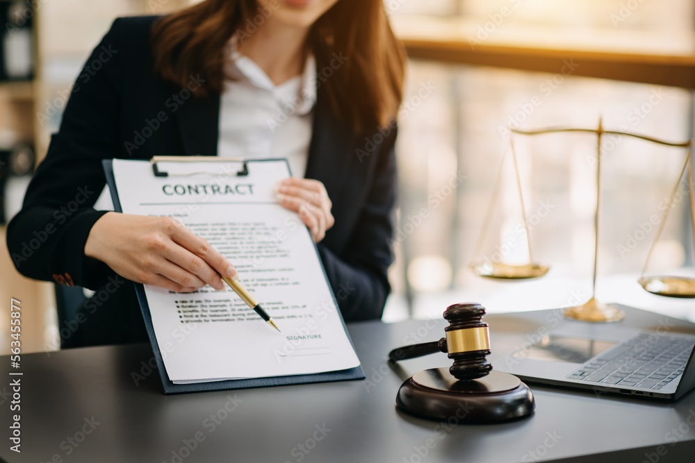 justice and law concept.Male judge in a courtroom on wooden table and Counselor or Male lawyer working in office. justice and law concept.Male judge in a courtroom on wooden table and Counselor or Male lawyer working in office.
