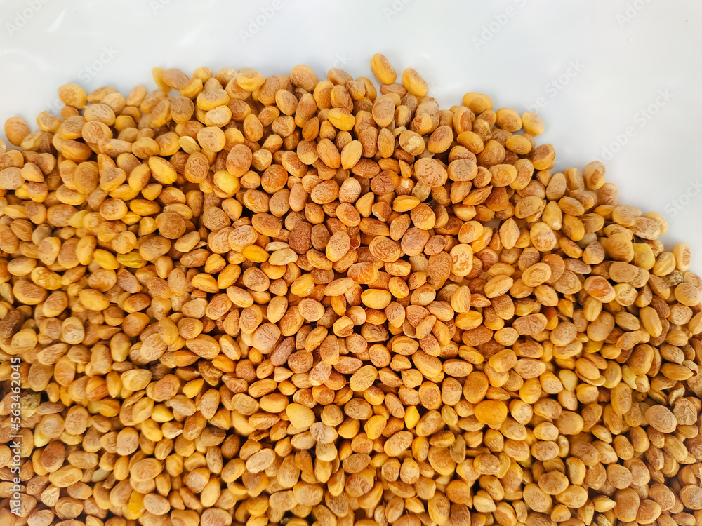 Close up top view of scattered Chironji seeds isolated over white Close up top view of scattered Chironji seeds isolated over white