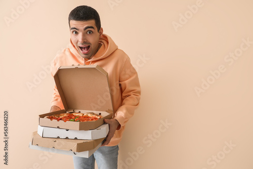 Surprised young man with bo...