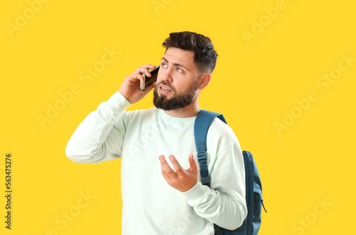 Young bearded man with back...