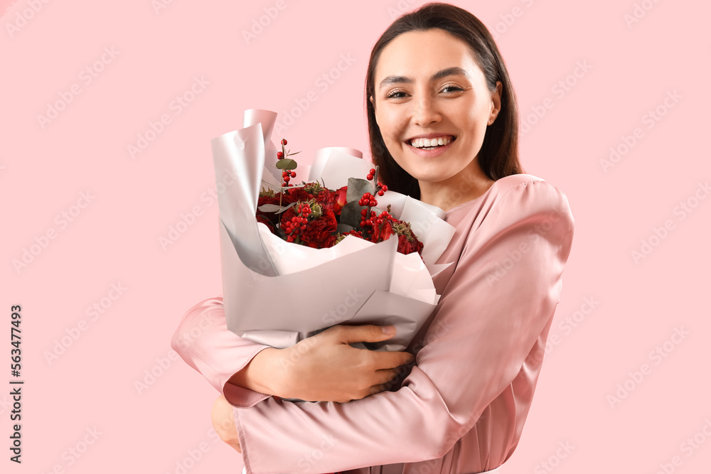Young woman with bouquet of flowers on pink background. Valentine's Day celebration Young woman with bouquet of flowers on pink background. Valentine's Day celebration