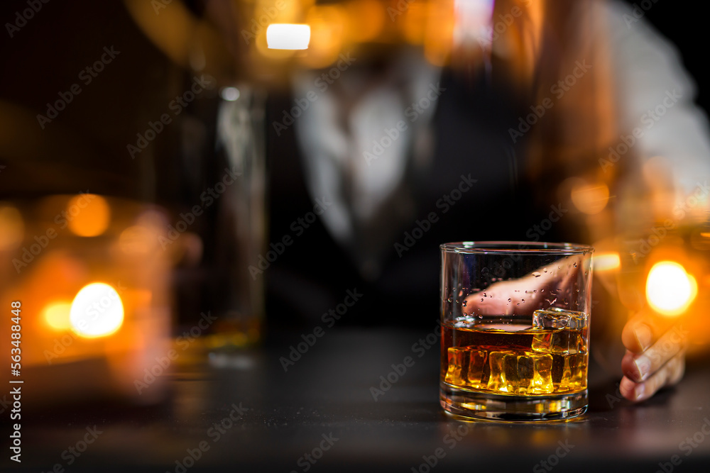 Closeup businessmen holding a glass of whiskey Closeup businessmen holding a glass of whiskey