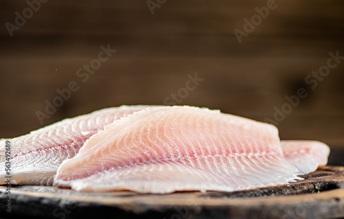 Fresh fish fillet on a cutting board. 