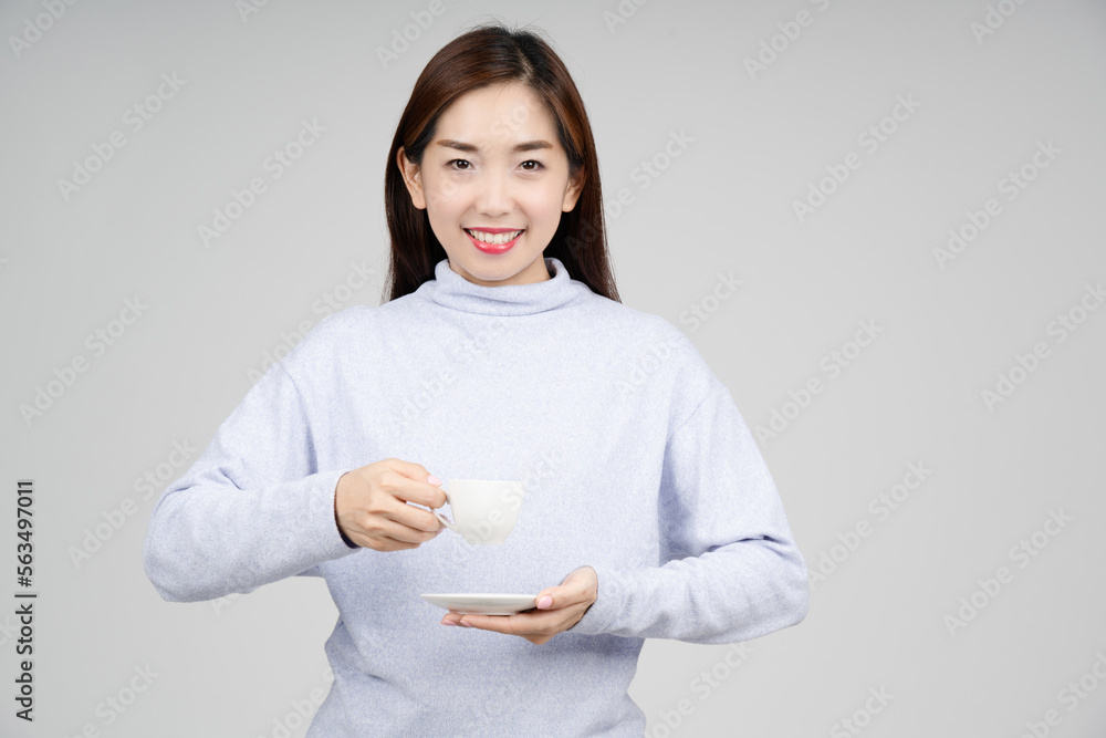 Portrait of Asian woman smiling happily holding cup of coffee on isolate background. Portrait of Asian woman smiling happily holding cup of coffee on isolate background.
