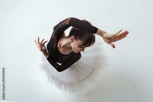 Fotografija angle from above on a ballerina up to the waist with her hands showing a dance
