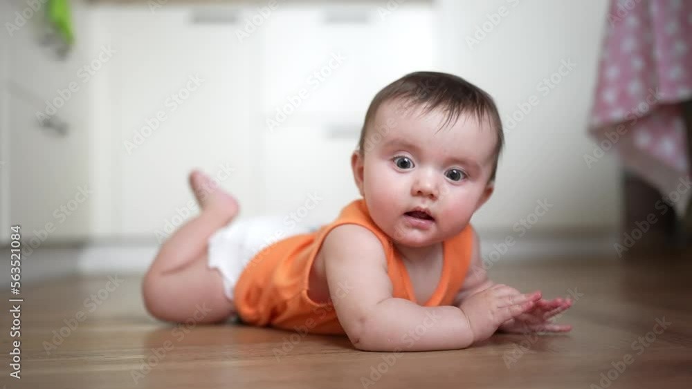beautiful baby crawling. carefree childhood. baby a girl funny crawling on the pope on the floor learning to crawl. Portrait lifestyle of colorful baby crawling beautiful baby crawling. carefree childhood. baby a girl funny crawling on the pope on the floor learning to crawl. Portrait lifestyle of colorful baby crawling