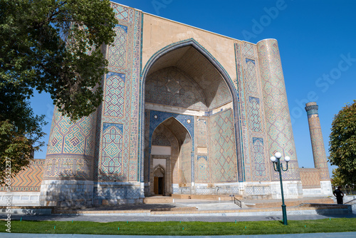 The main portal of the medieval Bibi Khanum Madrasah (1404) close-up on a sunny September day. Samarkand