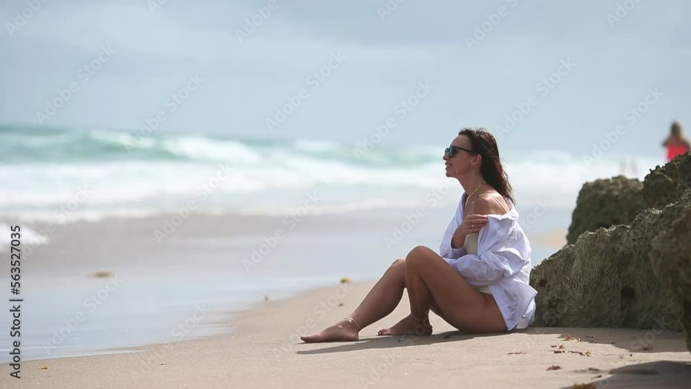 Young beautiful woman relax on the beach Young beautiful woman relax on the beach