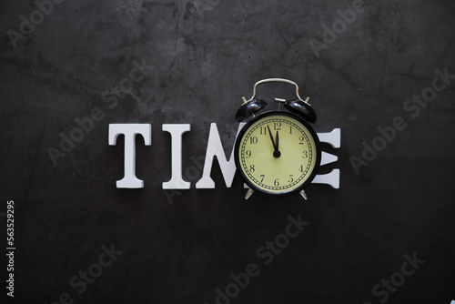 Wallpaper Mural Big alarm clock. The clock is on the table. The inscription "time". Time for rest and travel. Torontodigital.ca