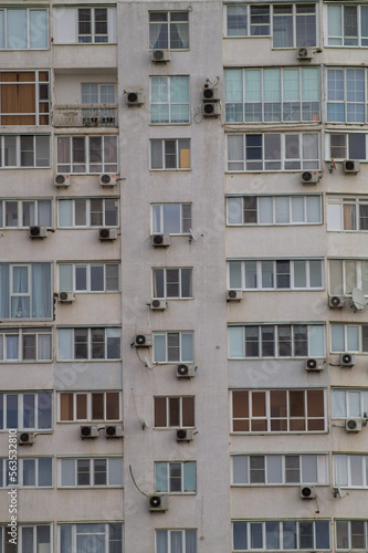 Close-up windows of a multi-storey residential building. Modern residential real estate in the city © Михаил Таратонов