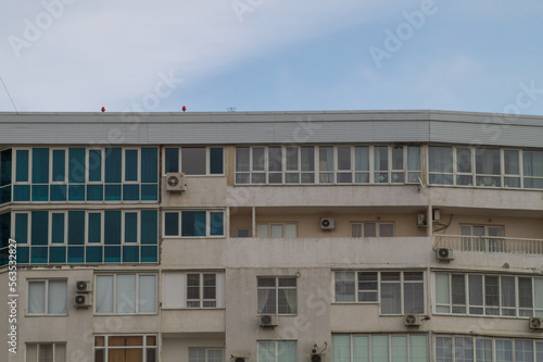 Close-up windows of a multi-storey residential building. Modern residential real estate in the city