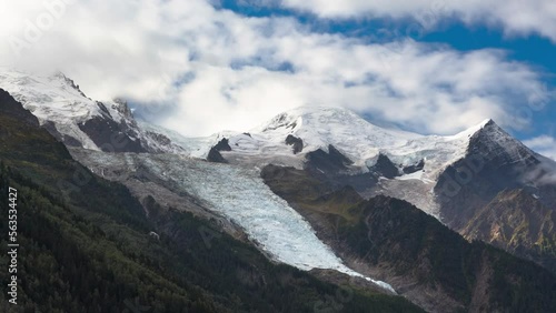 Mont Blanc Time Lapse bottom view during morning sunrise with clouds snow and glaciers From Chamonix in France