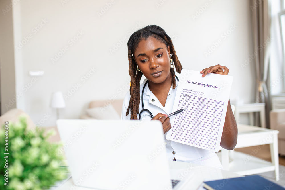 African woman doctor talking online with patient, making video call, looking at camera, young female wearing white uniform with stethoscope speaking, consulting and therapy concept African woman doctor talking online with patient, making video call, looking at camera, young female wearing white uniform with stethoscope speaking, consulting and therapy concept