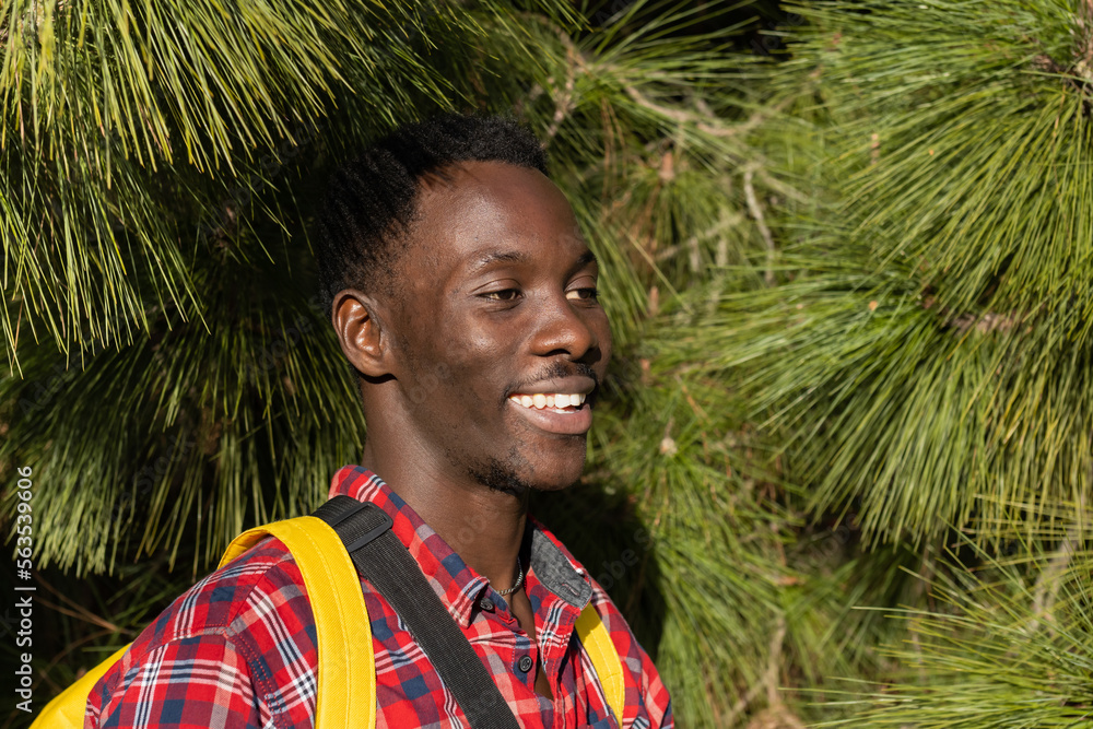 Happy African man on vacation in a garden on the island of La Palma, Canary Islands (Spain). Happy African man on vacation in a garden on the island of La Palma, Canary Islands (Spain).