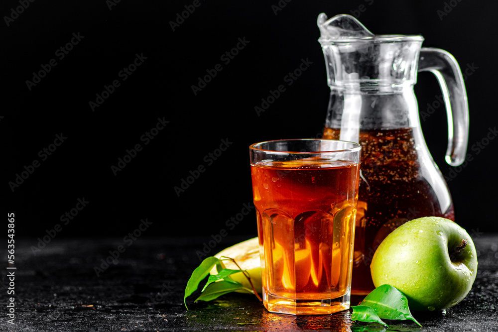 Apple juice in a glass and jug. Apple juice in a glass and jug.