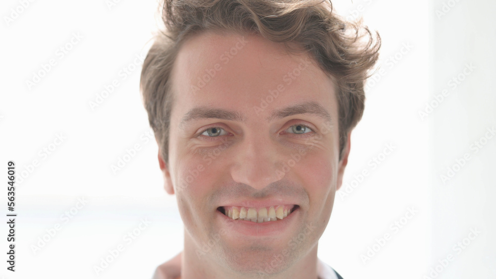 Face Close Up of Smiling Young Man Face Close Up of Smiling Young Man