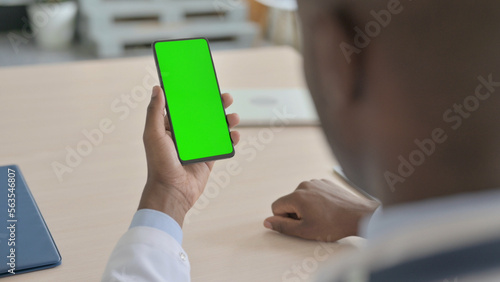 Close Up of African Doctor Using Smartphone with Green Screen
