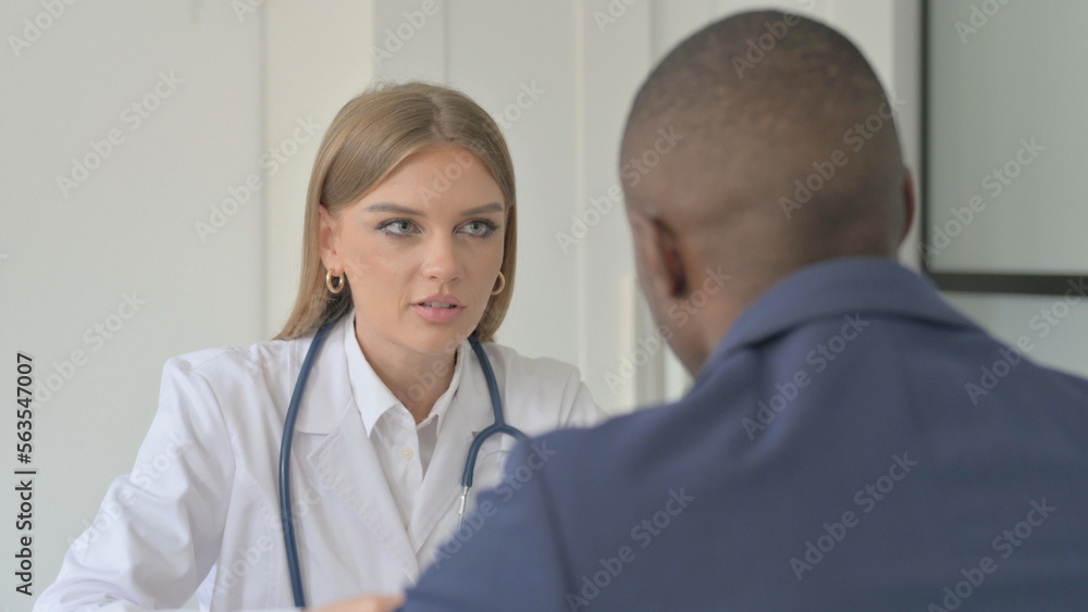 Female Doctor Talking with African Man Patient Female Doctor Talking with African Man Patient