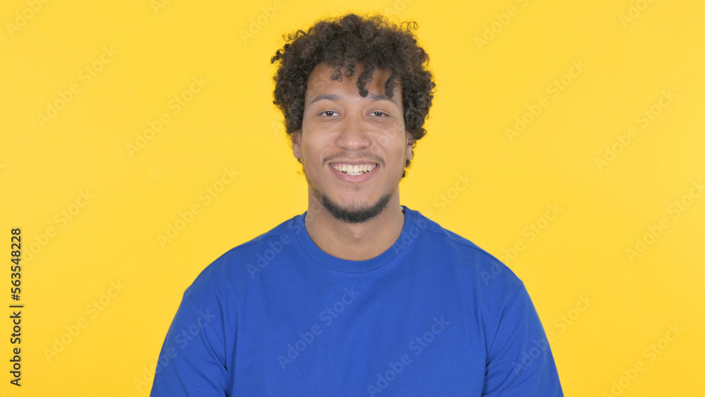 Smiling African Man on Yellow Background Smiling African Man on Yellow Background