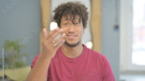 Portrait of Inviting African Man Pointing at the Camera