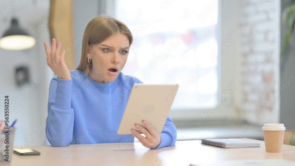 Shocked Woman Reacting to Loss on Digital Tablet Shocked Woman Reacting to Loss on Digital Tablet