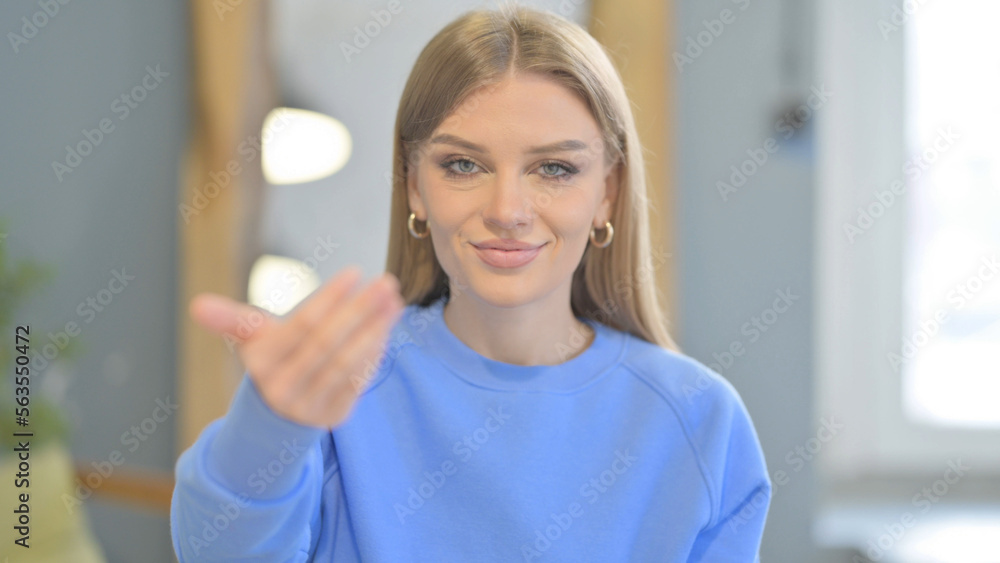 Portrait of Inviting Woman Pointing at the Camera