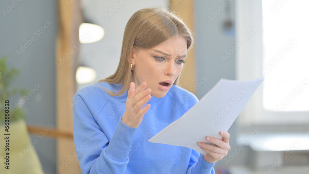 Upset Woman Feeling Embarrassed while Reading Contract