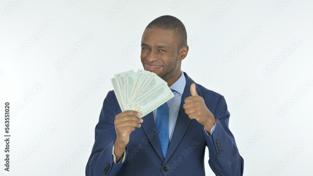 African Businessman Showing Dollar Bills on White Background African Businessman Showing Dollar Bills on White Background