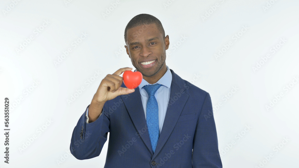 African Businessman Holding Red Heart on White Background