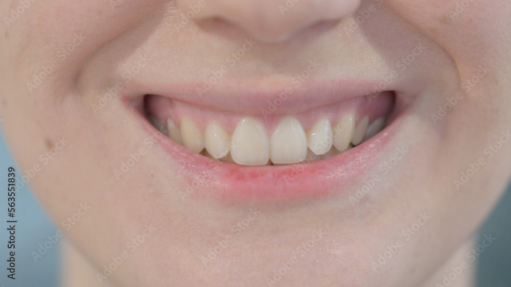 Fototapeta premium Close Up of Smiling Lips of Woman