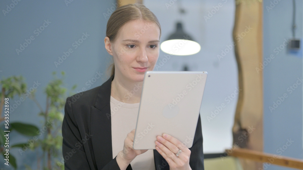Businesswoman Browsing Internet on Digital Tablet Businesswoman Browsing Internet on Digital Tablet