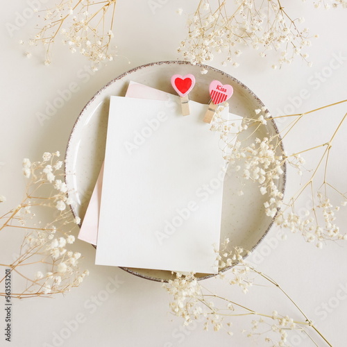 Valentines Day blank papers, greeting cards mockup with clothespins hearts on...