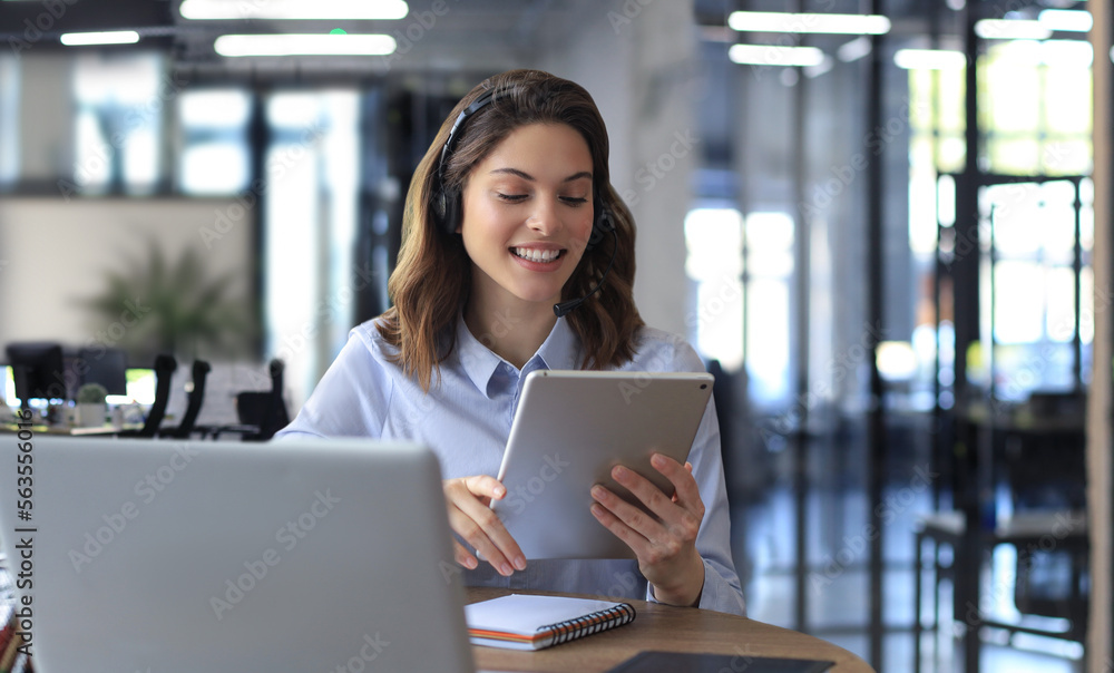 Freelance business women using tablet working call video conference with customer in workplace at modern office. Freelance business women using tablet working call video conference with customer in workplace at modern office.