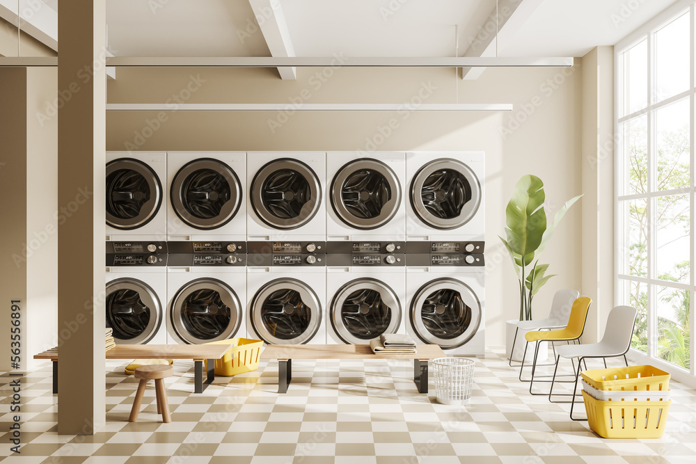 Light laundry interior with row of washing machines and panoramic window - obrazy, fototapety, plakaty 