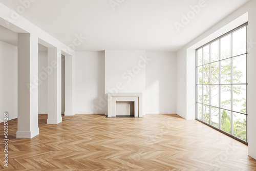 Light empty room interior with fireplace, panoramic window and column