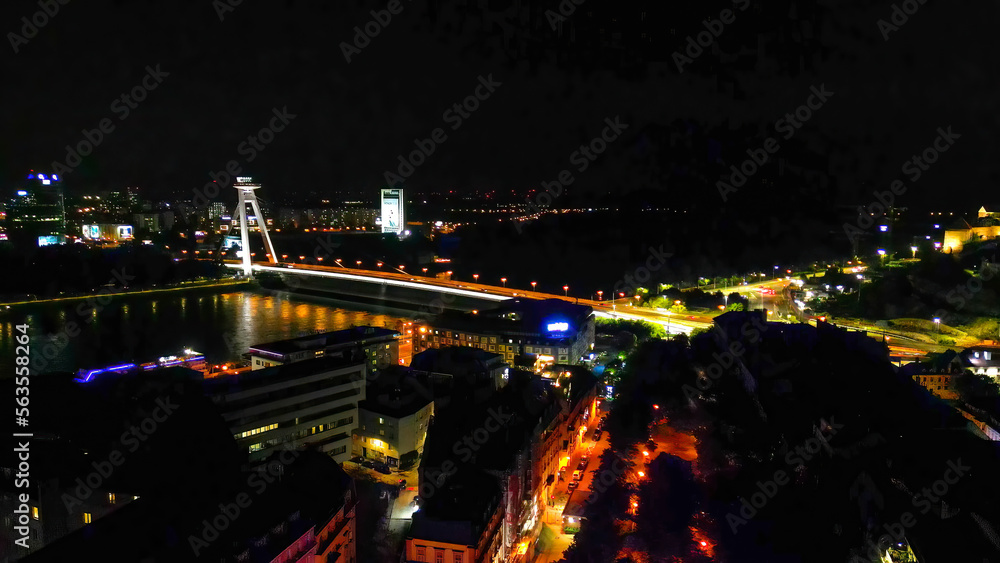 Aerial view of Bratislava city skyline at night from drone, Slovakia