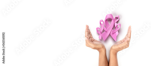 hands holding 3d pink ribbon for symbolic of encurage breast cancer awareness  © Cozine