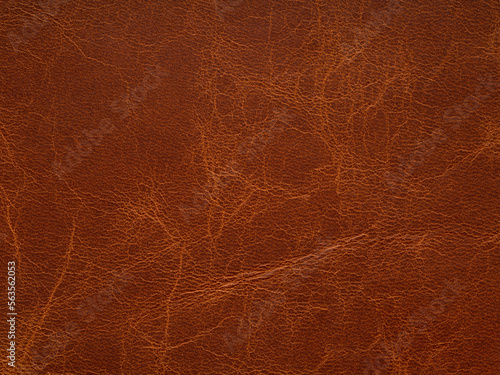 Genuine brown leather. Natural material with design lines. Pattern or abstract background. Genuine leather texture. Use wallpaper or backdrop luxury event, design upholstered furniture, clothing.
