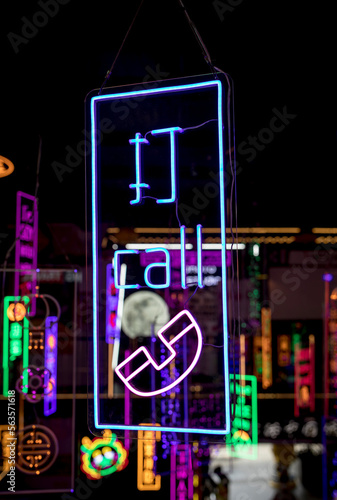 Call neon light in black background photo