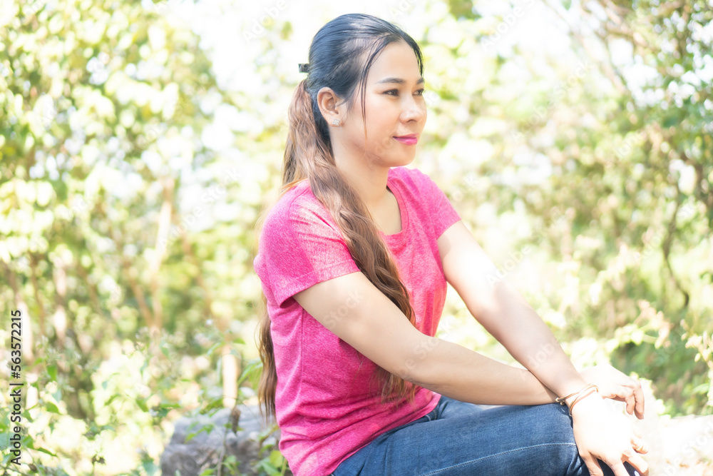 Beautiful girls sit on their backs and put their hands on their feet