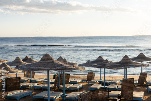 Fototapeta Naklejka Na Ścianę i Meble -  straw beach umbrella with blue sky.